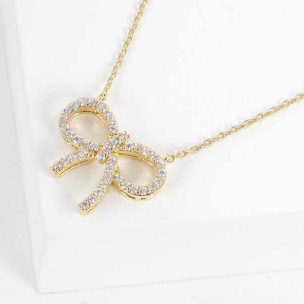 RHINESTONE BOW CHARM GOLD DIPPED NECKLACE
