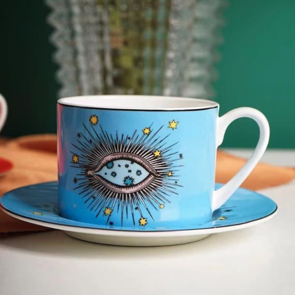 EYE COFFEE CUP AND SAUCER SET IN VIVID ORANGE OR BLUE