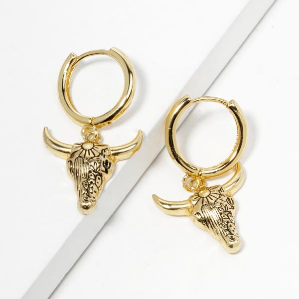 GOLD DIPPED COW SKULL HOOP EARRING