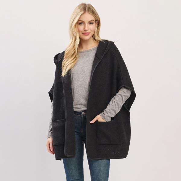 HOODED PONCHO WITH TRIM AND FRONT POCKETS.
