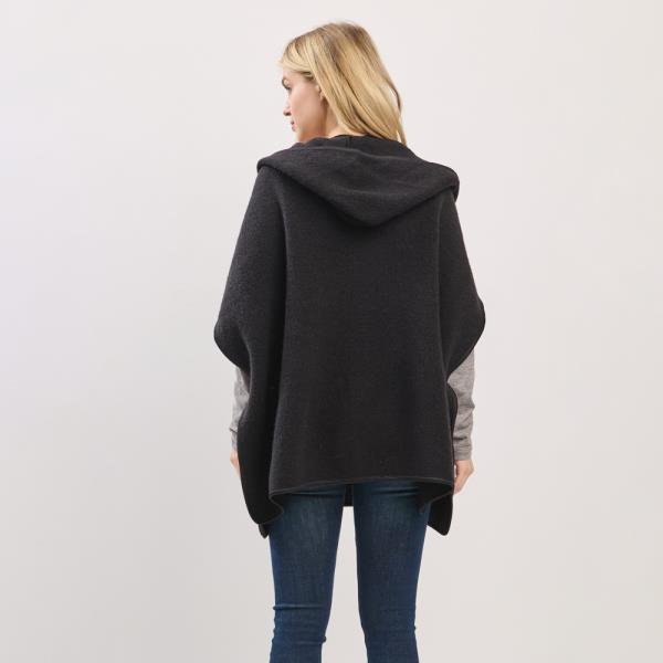 HOODED PONCHO WITH TRIM AND FRONT POCKETS.
