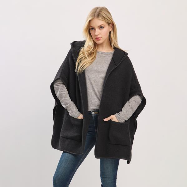 HOODED PONCHO WITH TRIM AND FRONT POCKETS.