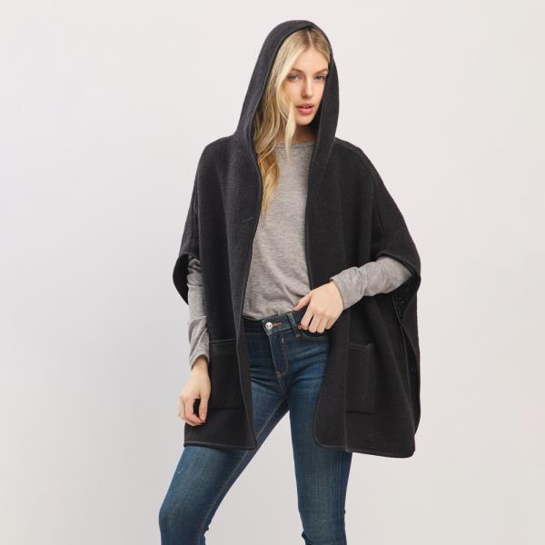 HOODED PONCHO WITH TRIM AND FRONT POCKETS.