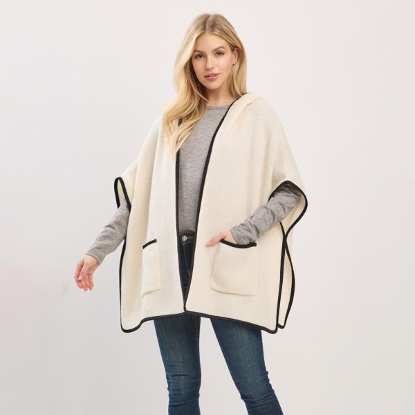 HOODED PONCHO WITH TRIM AND FRONT POCKETS.