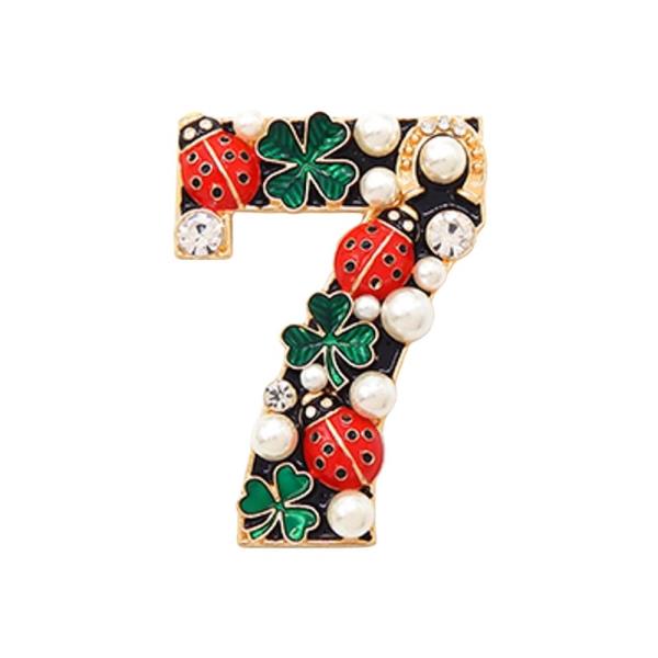 BROOCH IN THE SHAPE OF THE NUMBER SEVEN DECORATED WITH RED LADYBUGS, GREEN CLOVERS, PEARLS, AND CRYSTALS
