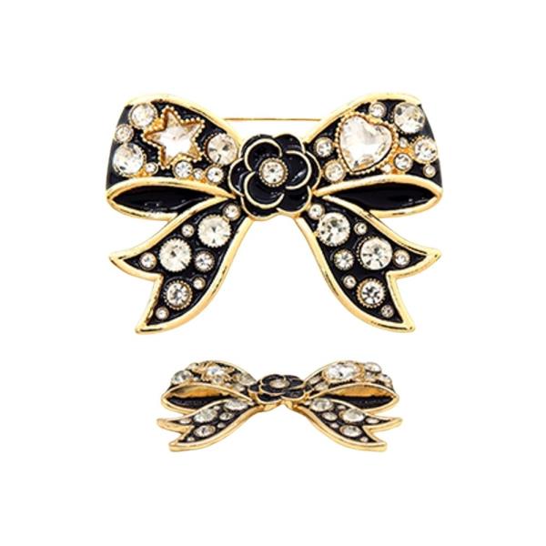 BOW BROOCH DECORATED, SPARKLING CRYSTALS, AND A CENTRAL FLOWER DETAIL