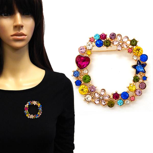 AN ORNATE CIRCULAR BROOCH ADORNED WITH SPARKLING CRYSTALS IN VARIOUS SHAPES INCLUDING FLOWERS, A STAR, AND A HEART